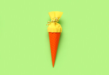 Yellow school cone on green background