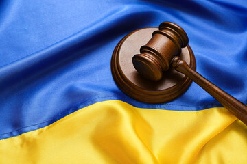 Judge's gavel on flag of Ukraine