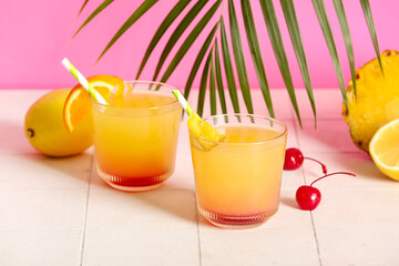Glasses of tasty mai tai cocktail on table