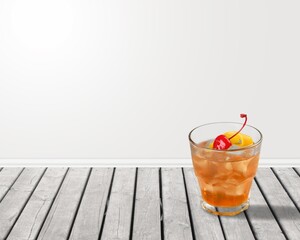 Fresh cold alcohol drink in glass on desk