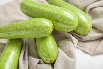 Fresh green zucchini on table