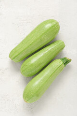 Fresh green zucchini on light background