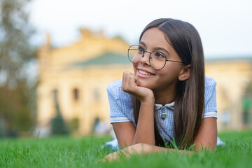girl in eyewear at lawn, advertisement. girl in eyewear at lawn with grass. girl in eyewear at lawn
