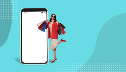 Happy stylish woman with shopping bags near huge smartphone on color background. Advertising mockup with space for design