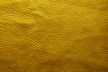 Golden textured surface as background, closeup view