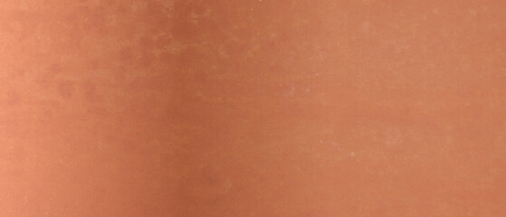 Shiny bronze surface as background, closeup view