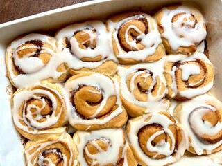 Cinnamon rolls in a white baking dish