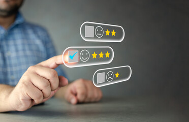 Customer service and satisfaction concept. Customer touching the virtual screen on the happy face icon. Customer evaluate quality of service leading to reputation ranking of business.