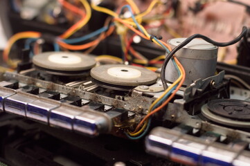 Fototapeta na wymiar Tape pulling mechanism of the cassette deck. tape recorder repair.