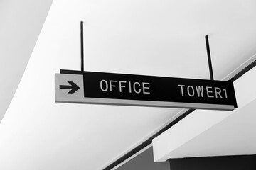 Office sign suspended from the ceiling