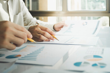 Team work process. Young business managers crew working with new startup project.