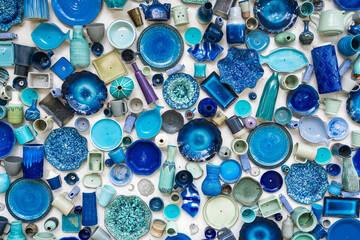 Different colorful ceramic plates on the wall.