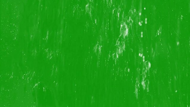 Splashing liquid on window greenscreen background