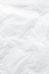 Top view of crumpled parchment paper, textured paper background, squeezed parchment paper for baking