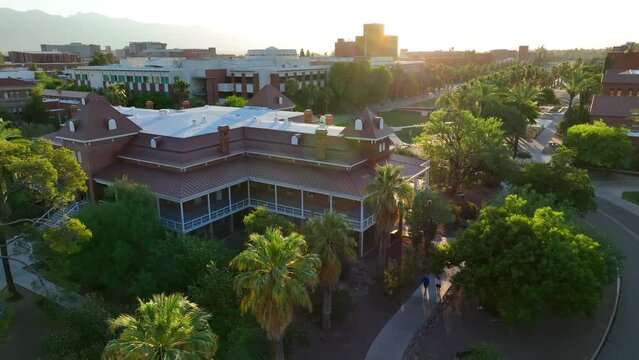 Old Main building at University of Arizona. Aerial establishing shot of college campus in Tucson, Arizona during sunrise.