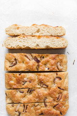 Top view of homemade onion focaccia on a white background, Flatlay of focaccia with red onion topping, fresh homemade focaccia bread