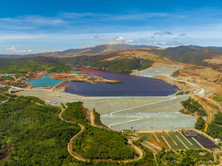 Open pit nickel mining and polluted lake. Mindanao, Philippines.