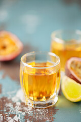 Passion Fruit Liqueur in shot glasses. Tropical natural drink