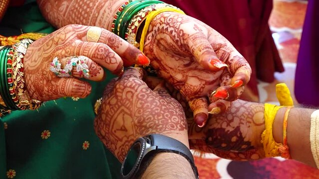 Ceremony of Wearing Turmeric Thread on hand of bride. Marathi Wedding Ceremony. Maharashtra Culture. Hindu wedding rituals and ceremony