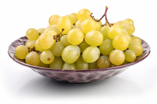 a plate of green grapes on a white background