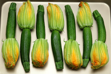 zucchini flowers in a tray