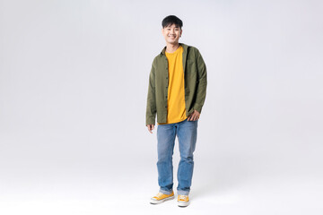 Naklejka premium Full length young Asian man happy smile in formal shirt on isolated studio white background. Asian man happy smile in studio shot.