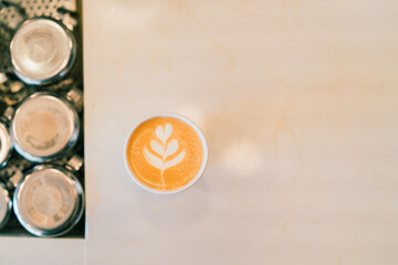 Latte on table paper cup