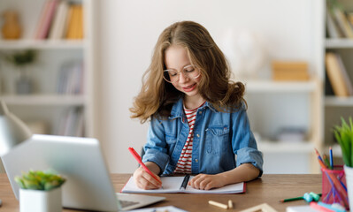 Girl doing homework or online education.