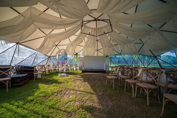 Fototapeta na wymiar The interior of a tent for an outdoor wedding event