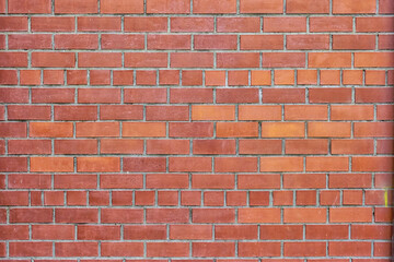 Obraz premium Red brick wall texture for background usage as a backdrop design.