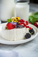 goat cheese with fresh berries and flowers