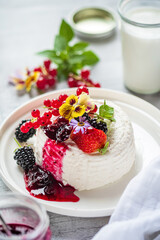 goat cheese with fresh berries and flowers