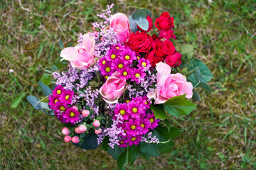 Colorful bouquet with pink and red flowers.
