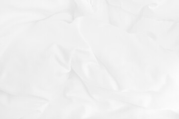 Texture of white blanket and bedding sheet with crumpled or messy in bedroom after wake up.