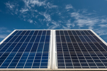 Obraz premium Detail of blue solar panels with blue sky