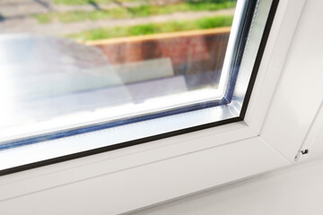 Bottom detail of window frame of PVC profiles. Window frame glass. Energy efficient, safety window...