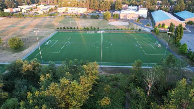 Captivating drone flight over Seattle's Sand Point soccer field. Experience the morning ambiance and motivational energy. Perfect for 4K soccer footage.