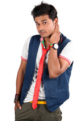 A young Indian guy appearing to be questioning, on white studio background.