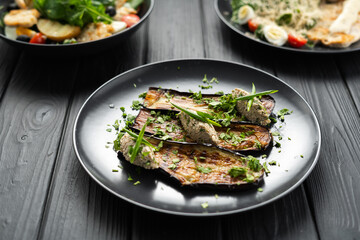 Eggplant with walnuts. Delicious fried eggplants with nuts, herbs and garlic. Dish of Georgian cuisine concept.