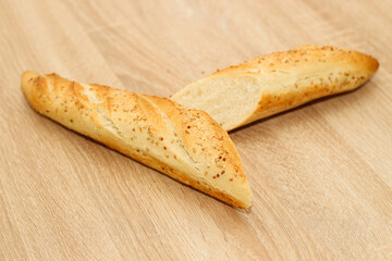 Fresh baguette made of white wheat flour with seeds and cereals
