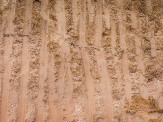 A close-up shot of excavator digger bucket teeth marks on the ground wall. - Digger's Bucket Marks © Andri