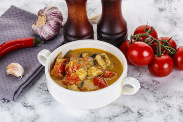 Traditional yellow Thai curry with chicken