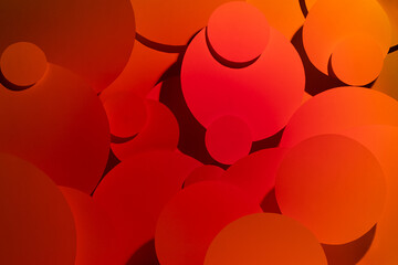 Saturated deep orange yellow red gradient abstract background of soar paper circles pattern, top...