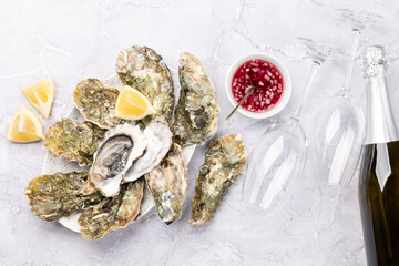 Fresh oysters with glasses of sparkling wine