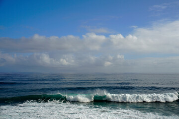Ocean .Waves wind and clouds. Landscapes of Madeira. Surf. Horizon. blue sky and clouds