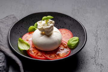 Burrata cheese, tomatoes and basil