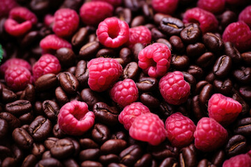 A mix of coffee beans and raspberries
