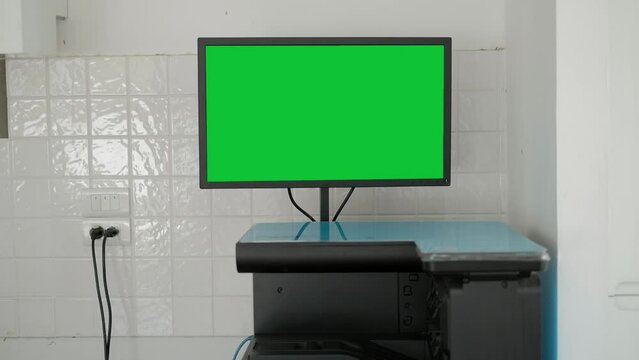 Chroma key green screen display smart copier or printer machine on work office.