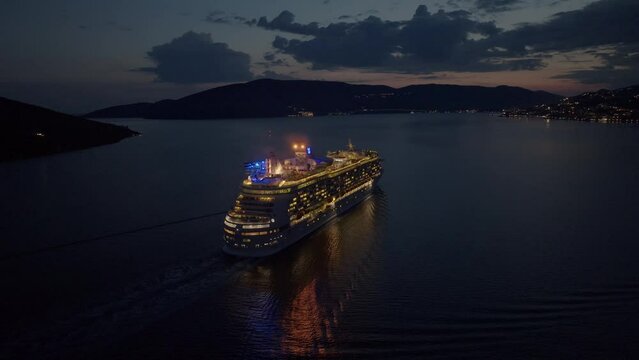 Kotor bay, montenegro, 5 june 2023: Cruise ship goes from Kotor Bay, Montenegro at night time. Aerial view 