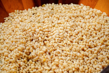 Boiled job's tears close-up in wooden bowl ,cereal healthy fresh organic in salad dish with high fiber,healthy whole grains, ingredients in Southeast Asia.